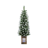 Artificial Christmas tree with snow effect in a decorative pot on a white background