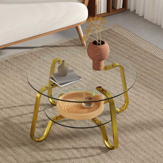 Elegant vintage metal coffee table featuring double glass layers and gold legs, placed on a beige rug in a cozy setting.