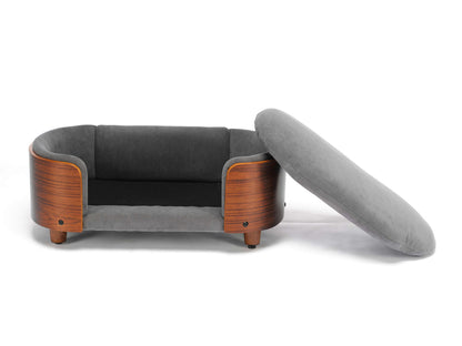 Orthopedic pet sofa with removable grey velvet cushion and curved wooden frame, part of the Scandinavian Elevated Dog Bed collection.