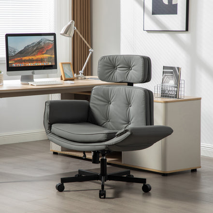 Gray office chair in a modern office setting with a desk and computer monitor.
