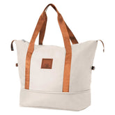 Beige tote bag with brown straps on a white background