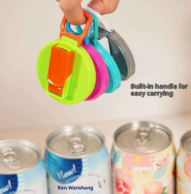 Colorful can opener with built-in handle held above a row of cans.