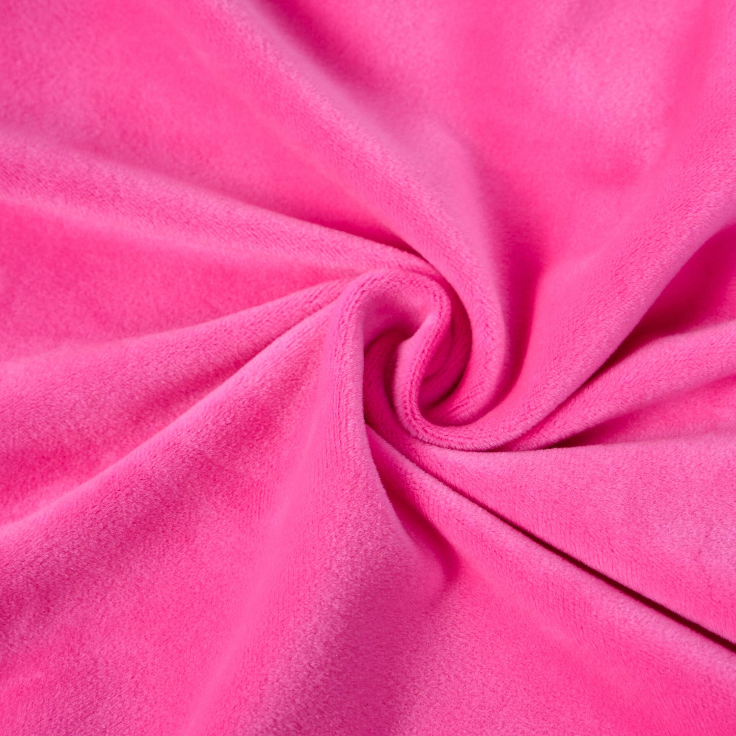 Close-up of soft pink fabric texture on ergonomic memory foam pillow, highlighting plush and skin-friendly material.