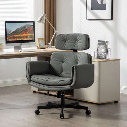 Gray office chair in a modern office setting with a desk and computer.