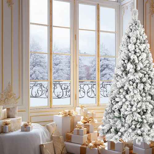 4 ft flocked Christmas tree beside a window