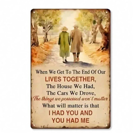 Vintage metal wall art for bars and cafes featuring an elderly couple walking hand in hand with a heartfelt quote about love and life.