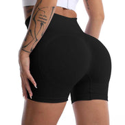 High waist yoga shorts in black with butt lift design, ideal for fitness and activewear. Seamless fit enhances curves and supports movement.