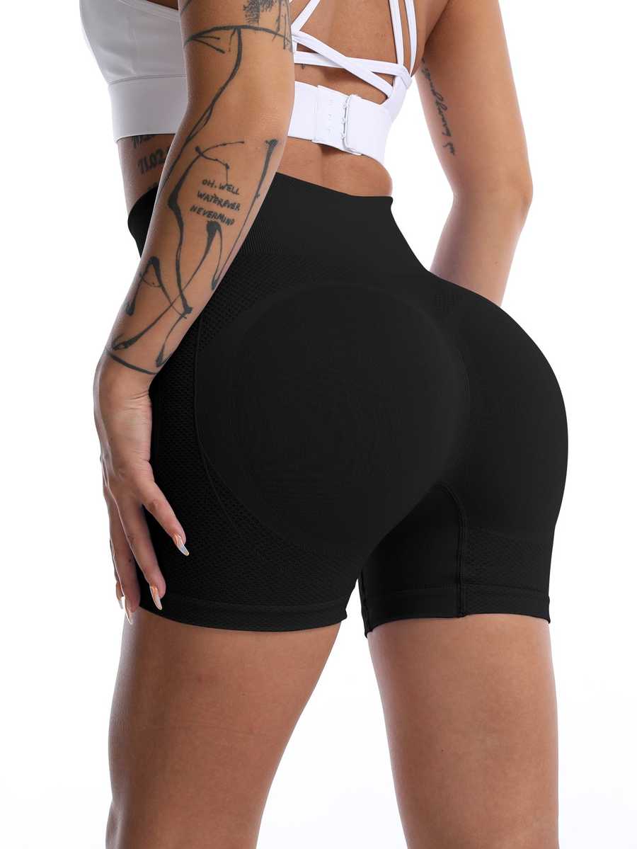 High waist yoga shorts in black with butt lift design, ideal for fitness and activewear. Seamless fit enhances curves and supports movement.