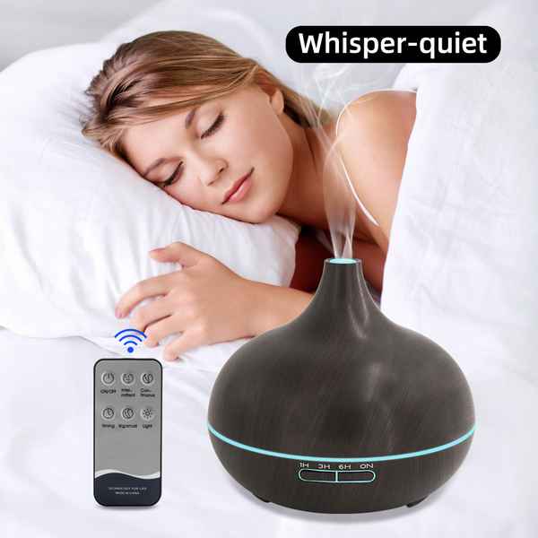Woman sleeping with a diffuser and remote control labeled &