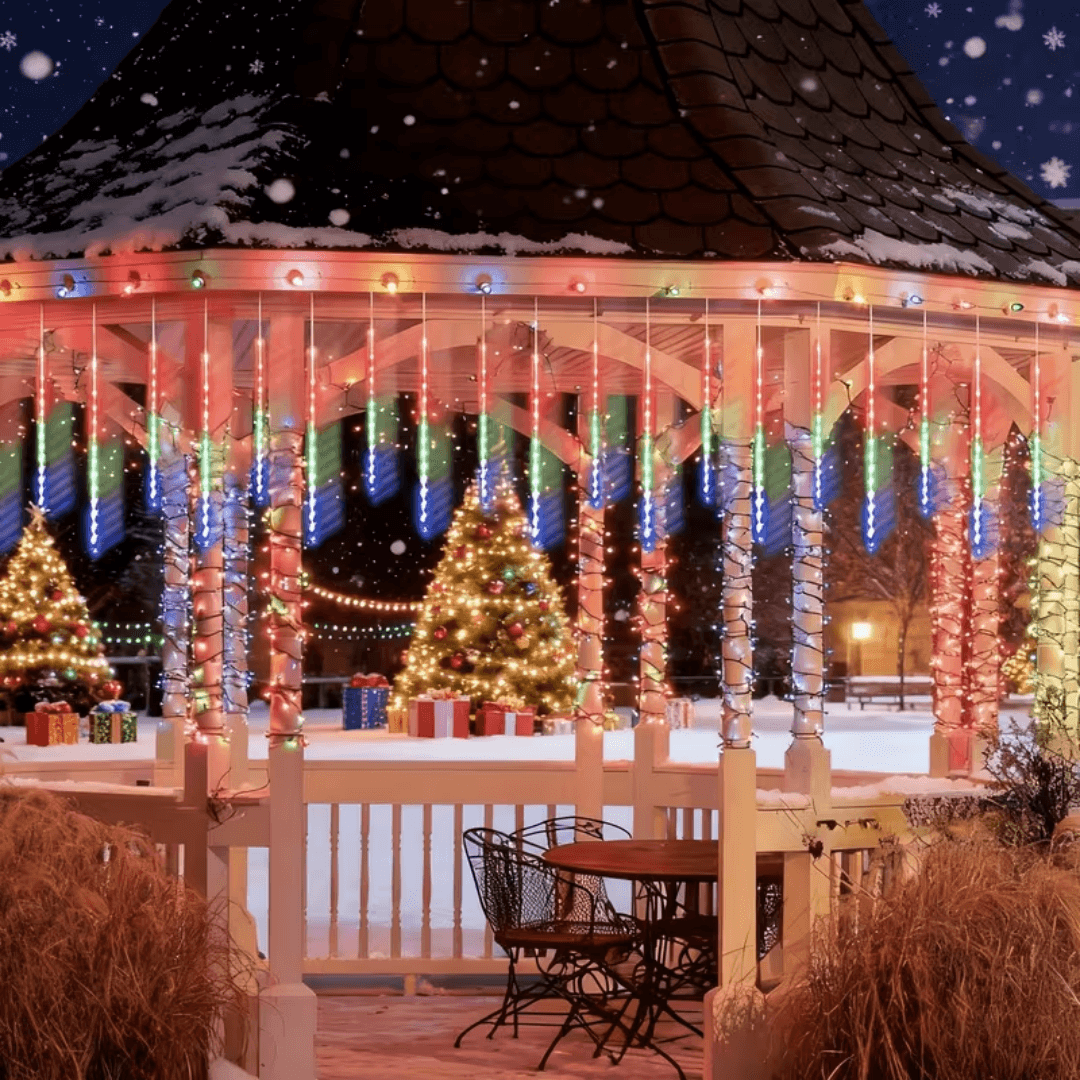 Gazebo decorated with meteor shower lights and a Christmas tree