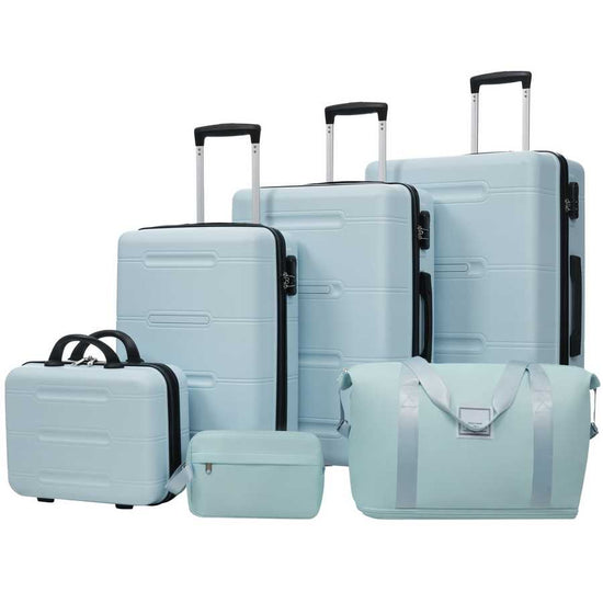 Set of light blue suitcases and travel bags on a white background