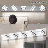 A five-light rectangular wall mirror light with rotating square-shaped LED reflectors, shown mounted above a mirror in a bathroom setting. A person&
