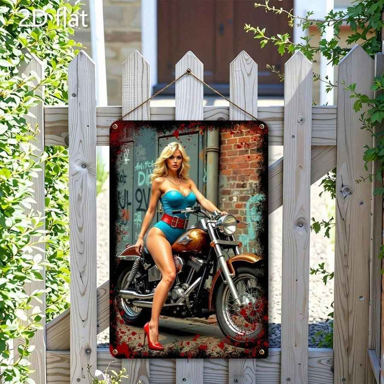 A rectangular metal wall sign with rounded corners hangs on a white picket fence outdoors. The sign features a stylized photo of a blonde woman in a blue swimsuit and red high heels seated on a motorcycle, with a distressed brick-and-door background and red splatter accents.