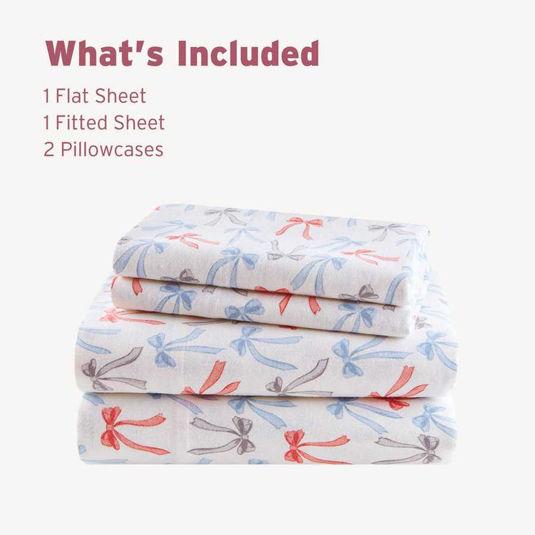 Folded Happy Bows Twin XL Cotton Flannel Sheet Set showing 1 flat sheet, 1 fitted sheet, and 2 pillowcases with bow pattern.