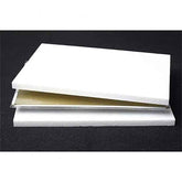 White foam core board with gold interior on a black background