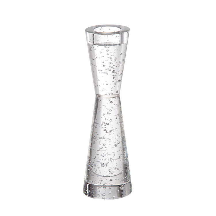 A clear glass hourglass-shaped tumbler with embedded air bubbles, shown on a plain white background.