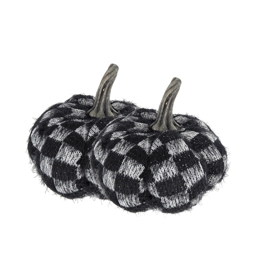Two small decorative pumpkins with a black and white checkered knit pattern and faux gray stems, shown on a plain white background.