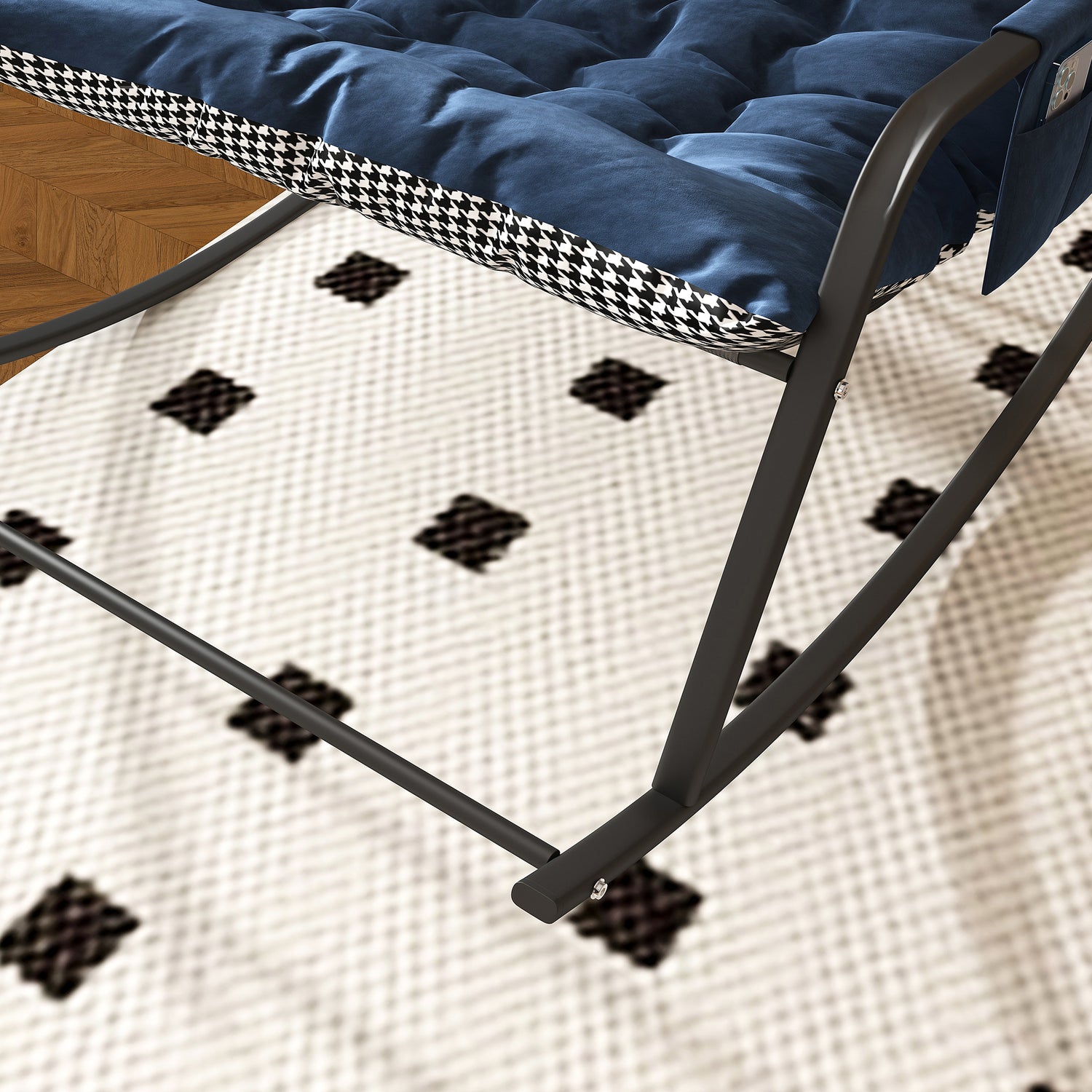 Folding chair with blue cushion on a textured surface