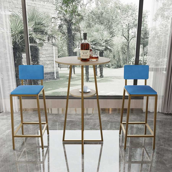 Bar Table and Chairs Set with gold frame and blue cushions, ideal for modern dining spaces. Features a round tabletop and lower shelf for storage.