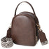 Brown leather handbag with a patterned strap on a white background
