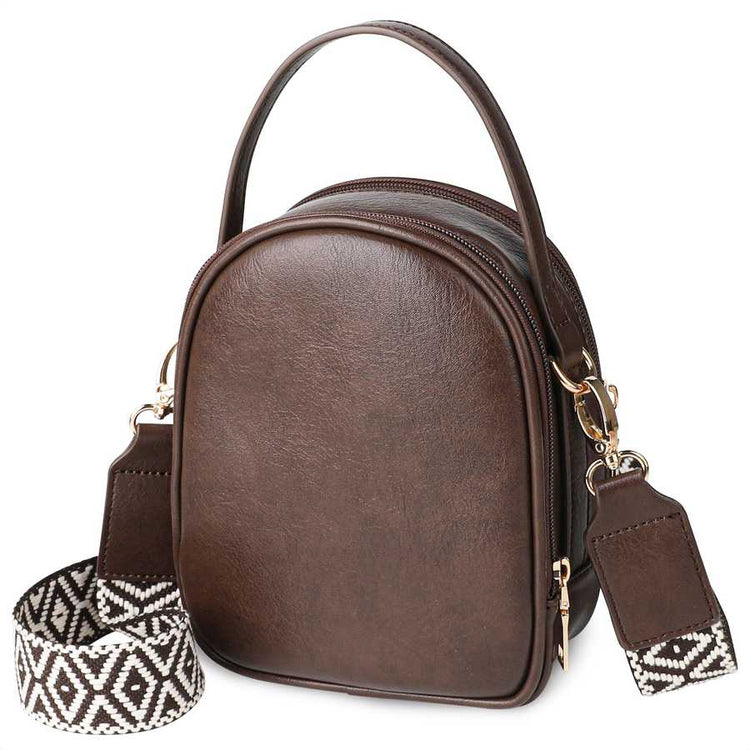 Brown leather handbag with a patterned strap on a white background
