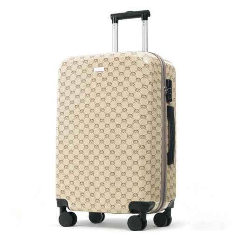 A hard-shell carry-on suitcase with an extended telescoping handle and four spinner wheels, featuring a beige and brown repeating monogram pattern. The suitcase is photographed on a clean white background.