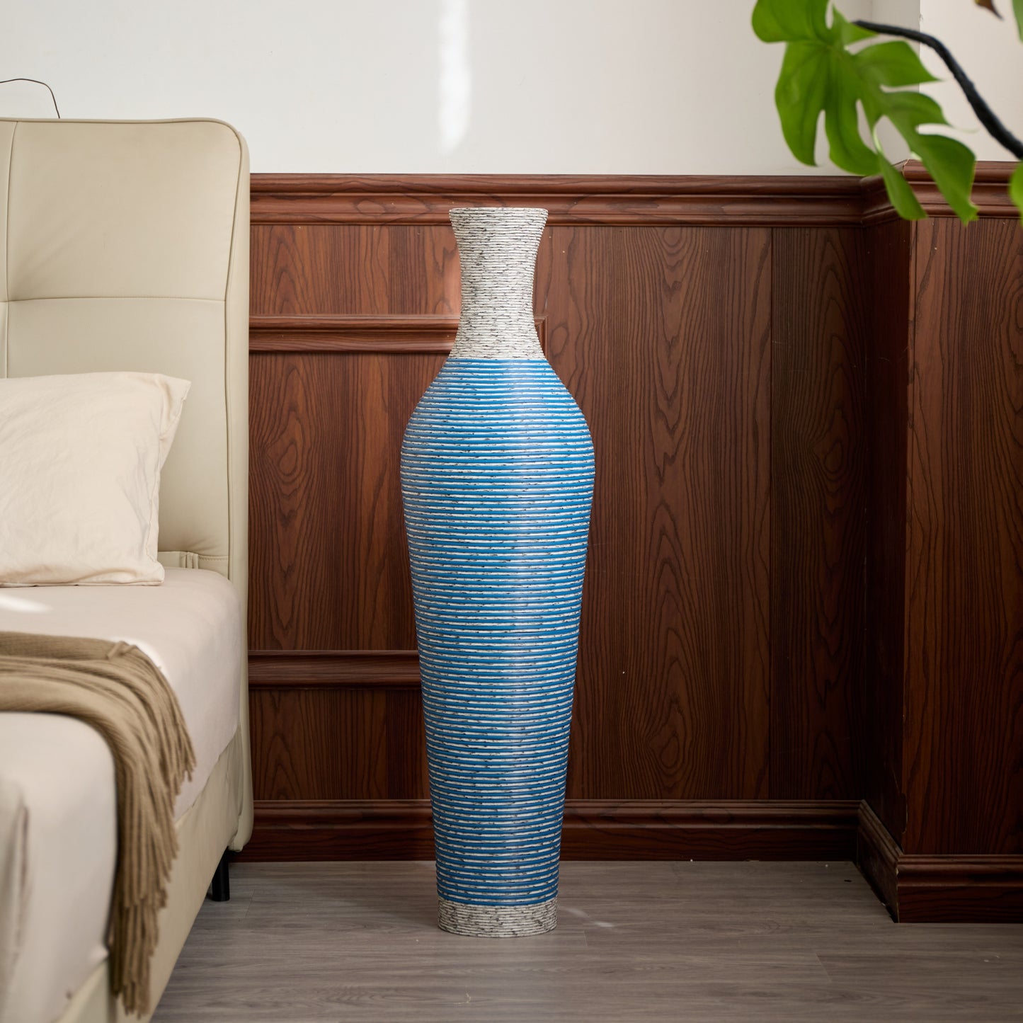 Elegant 39-inch PVC floor vase decor in blue tones styled in a wood-paneled bedroom corner for a sophisticated look.