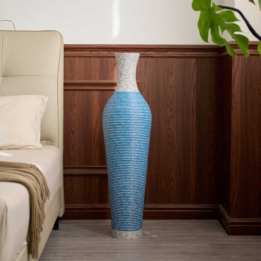 Elegant 39-inch PVC floor vase decor in blue tones styled in a wood-paneled bedroom corner for a sophisticated look.