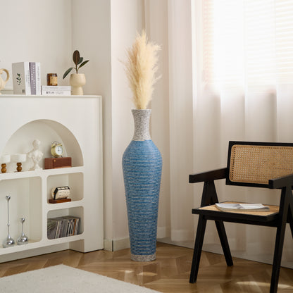 Blue and gray 39-inch floor vase decor with pampas grass placed in a bright, modern living room corner for visual appeal.