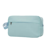 Light blue toiletry bag with a strap on a white background
