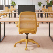 Yellow office chair in a modern office setting with desks and plants.
