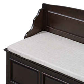 Dark brown wooden storage bench with a light beige upholstered cushion, shown on a white background.