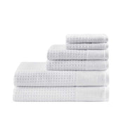 Stacked 6 piece Cotton Waffle Jacquard Bath Towel Set in white, featuring quick drying and textured jacquard design for home and spa use.