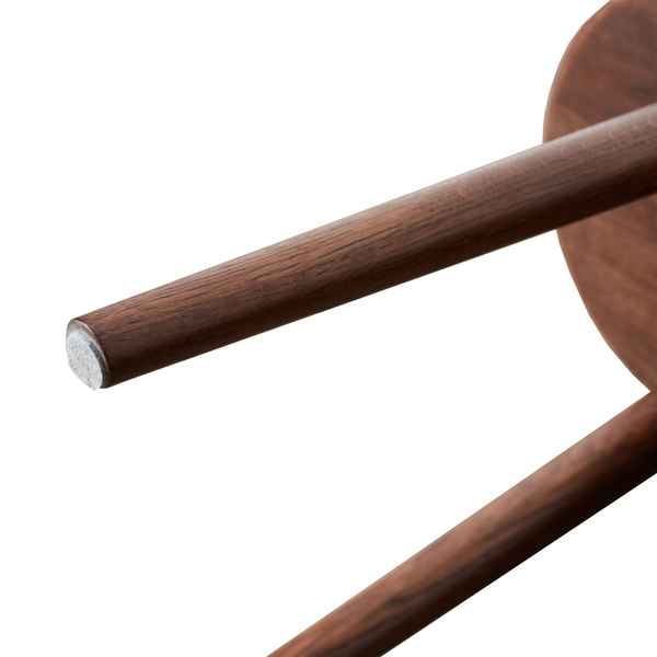 Close-up of a wooden spoon handle on a white background
