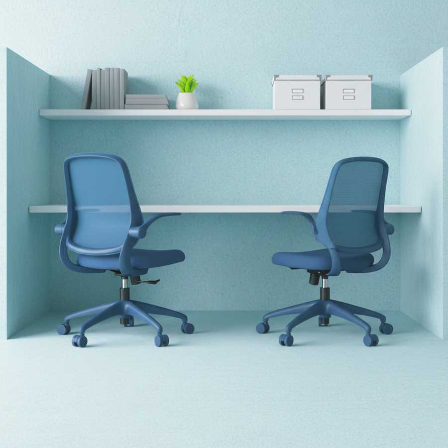 Two blue office chairs in a small office space with a white desk and shelves.