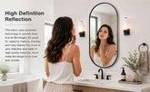 Woman applying makeup in a bathroom with a high-definition mirror.