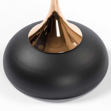 Base detail of the Modern Metal Mermaid Tail Coffee Table featuring a matte black rounded bottom and gold stem. Sturdy and stylish accent table.