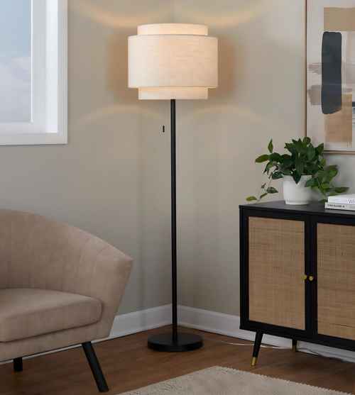 Floor lamp in a living room setting with a chair and cabinet.