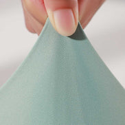 Stretch test of MLNshops MT20 Yoga Leggings fabric in green, demonstrating four-dimensional stretch for superior flexibility.