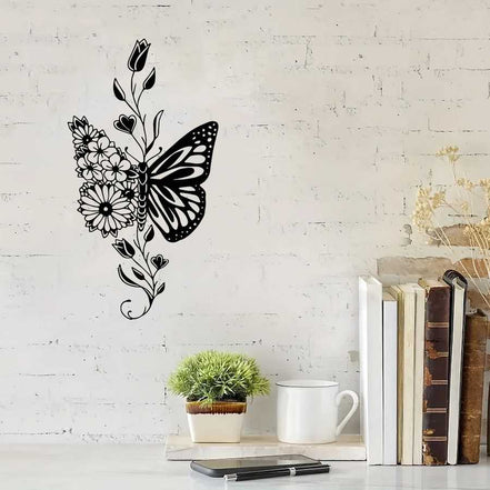 Aluminum butterfly wall art with floral design mounted on a white brick wall, ideal for farmhouse-style home decor.