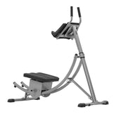 Gray and black elliptical exercise machine on a white background