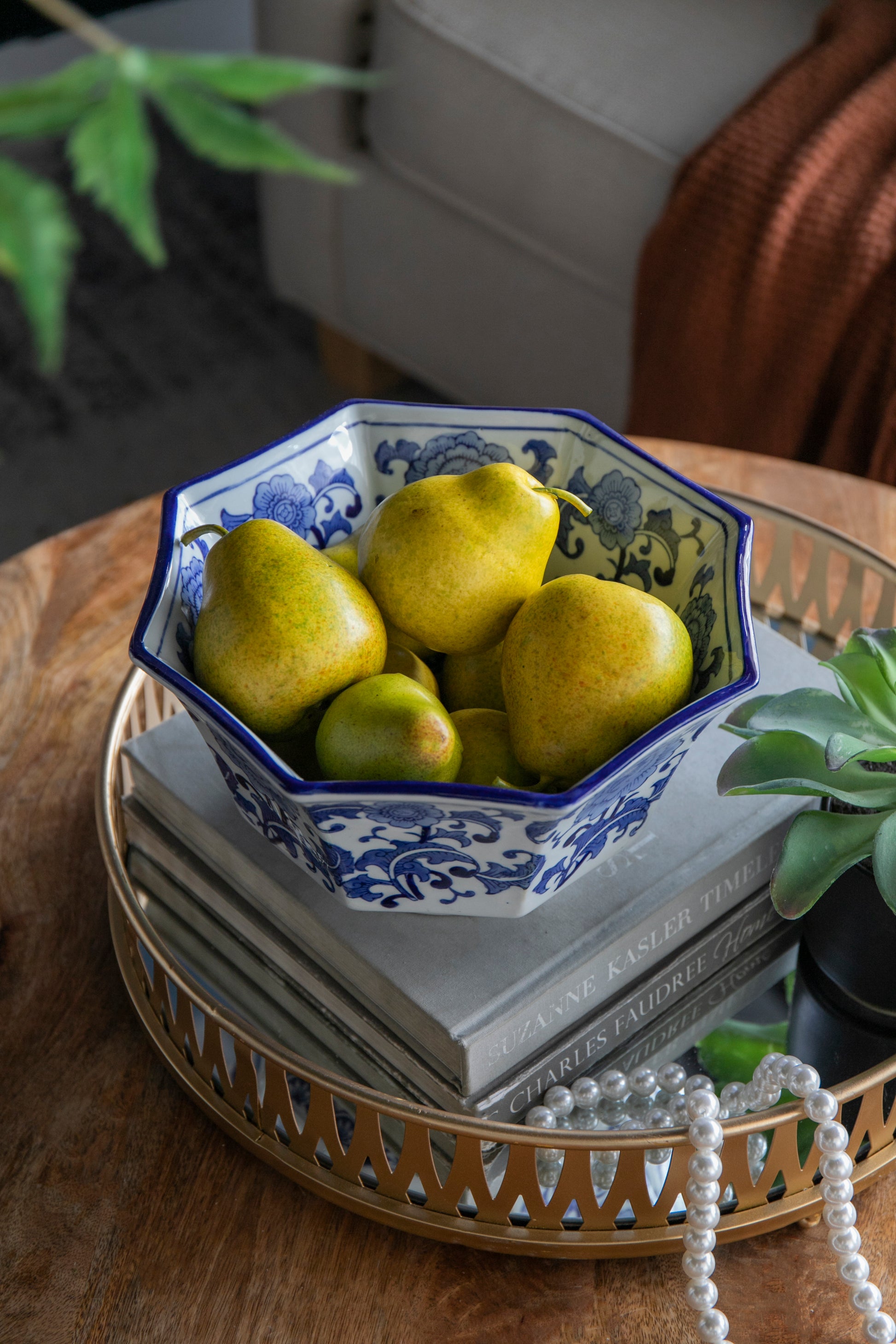 Blue and White Decorative Bowl - Porcelain, Elegant Design filled with pears, styled on a tray with books and a succulent.