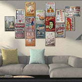 Collection of vintage-style metal signs on a wall above a sofa