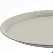 Edge detail of the Mermaid Tail Coffee Table's round grey top, emphasizing its smooth, durable finish and modern style.