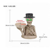 A skeleton figurine holding a bowl, shown with dimension lines and text indicating height, diameter, and width. The figurine has a beige bone color, a black hat, and glowing green eyes.