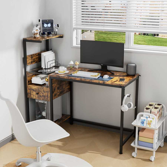 Computer desk with power outlet and reversible shelves in a home office setup, featuring rustic wood finish, monitor, and storage compartments.