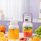 Portable blender with fruit smoothies on kitchen table