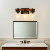 Bathroom vanity with mirror, faucet, and light fixture on a white wall.