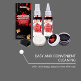 A fake blood makeup kit displayed on a dark gray background, including a black box, two bottles of fake blood, a small black sponge, a round bar of white soap, a small jar of dark red liquid, and text reading &