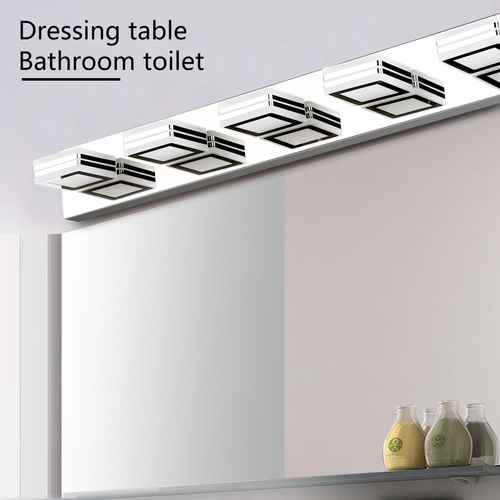 A bathroom lighting fixture mounted above a mirror, with the text &